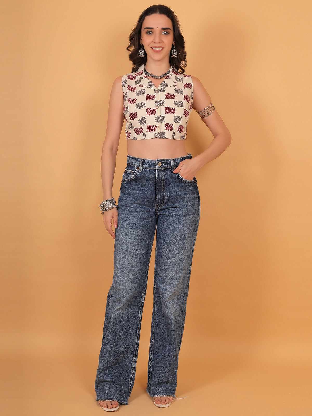 Sophisticated styling of the airavat sleeveless crop shirt with traditional silver jewelry, ideal for an Indian wear event or a lively Navratri garba night.