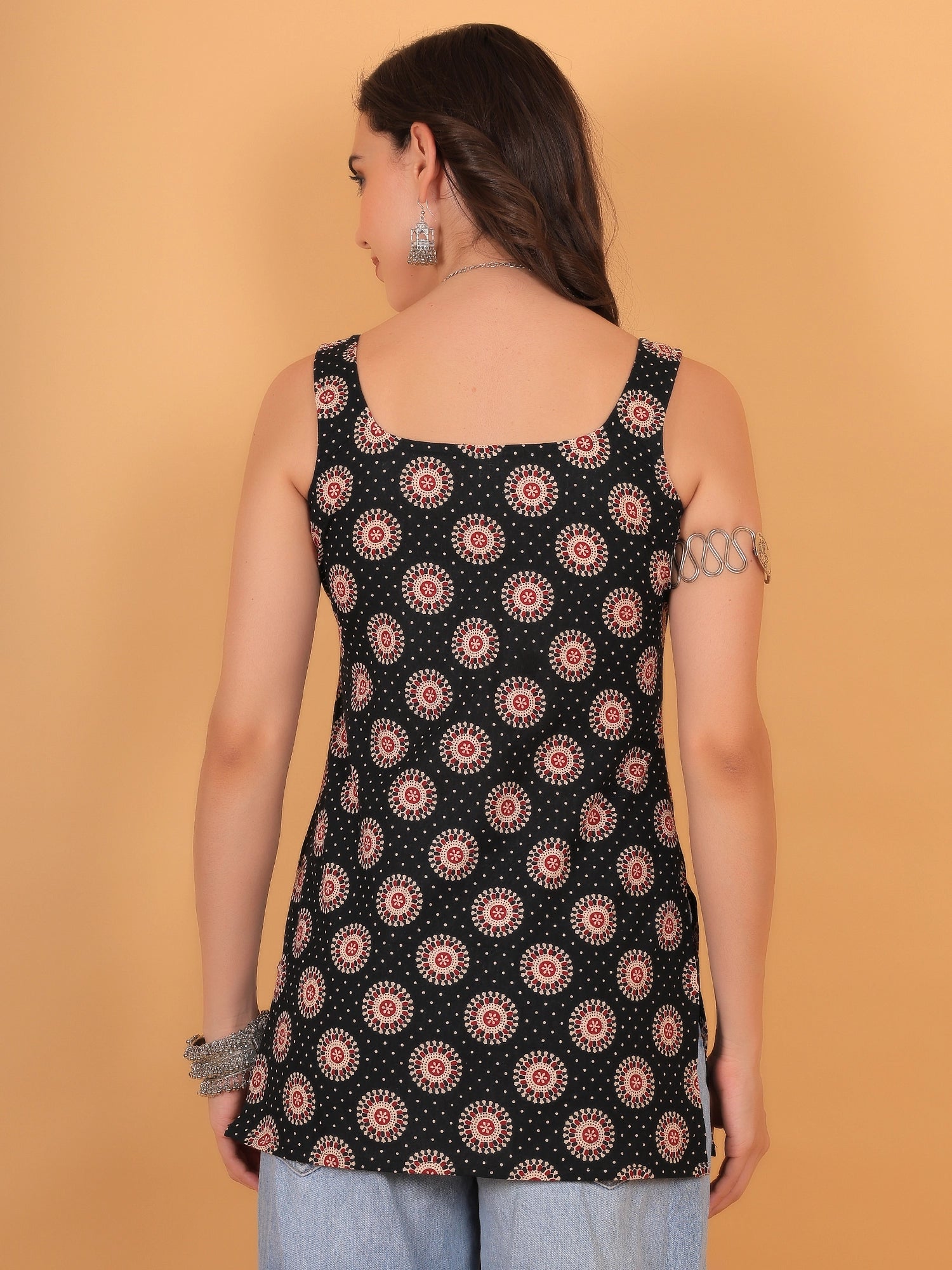 Back view styling of the black sleeveless short kurti, showcasing a clean regular back design and a comfortable regular fit.