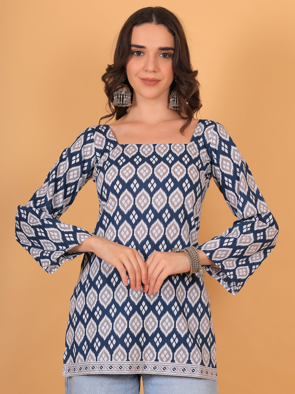 Blue and white Ikat print short kurti with square neckline and full bell sleeves
