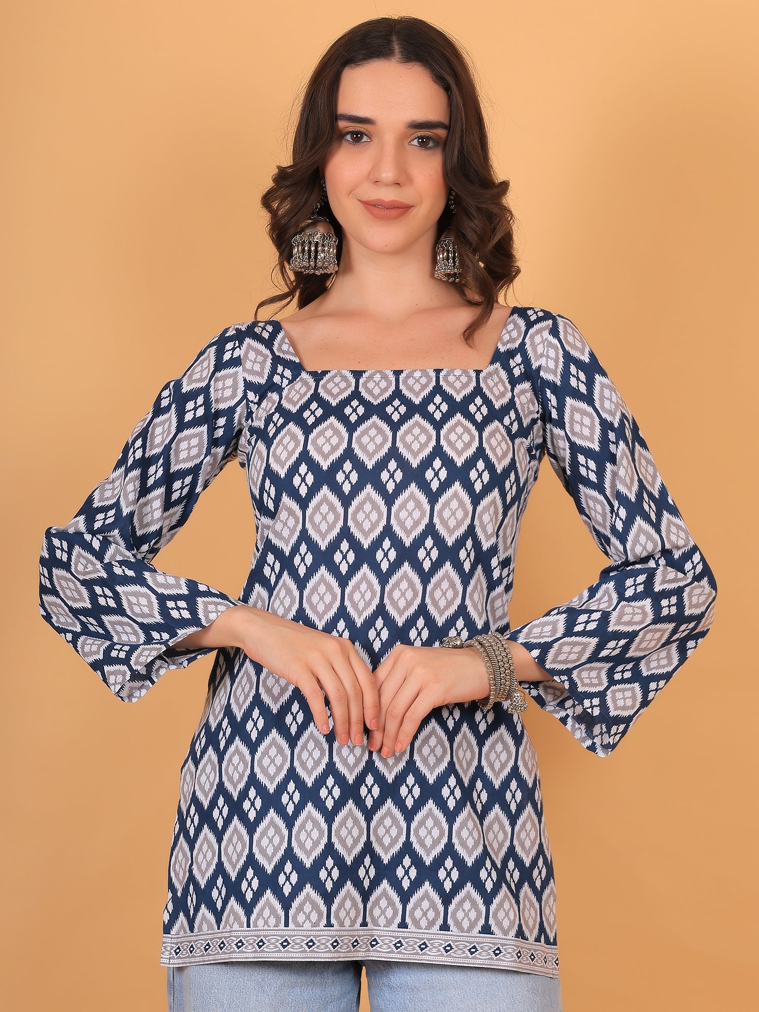 Blue and white Ikat print short kurti with square neckline and full bell sleeves
