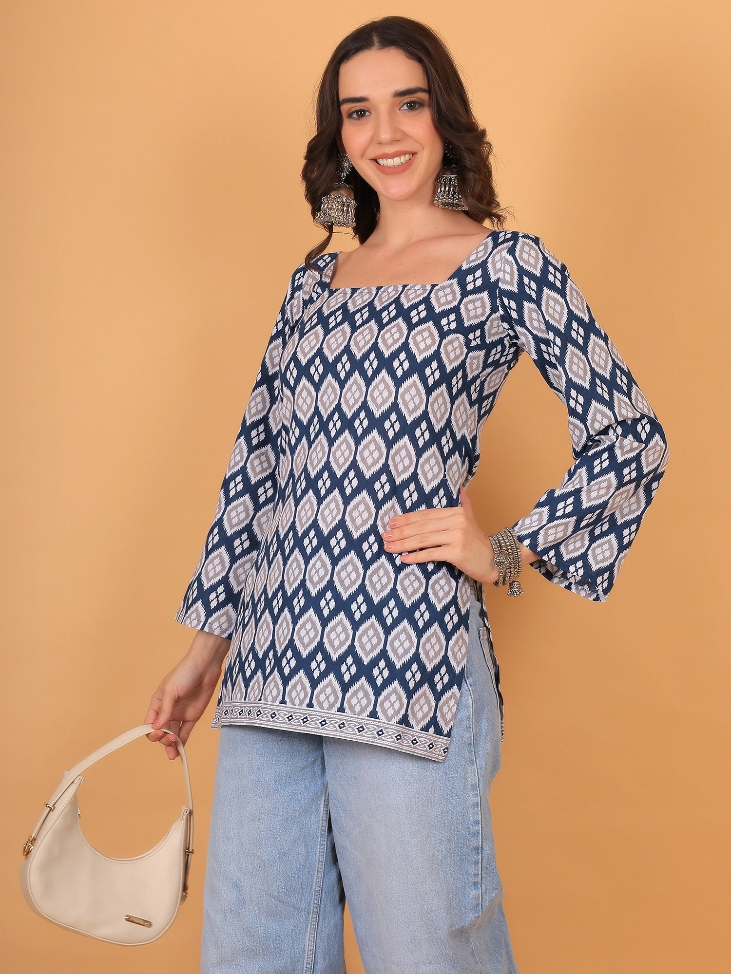 Indo western blue short kurti with full flared sleeves, ideal for college wear or an ethnic casual outfit.