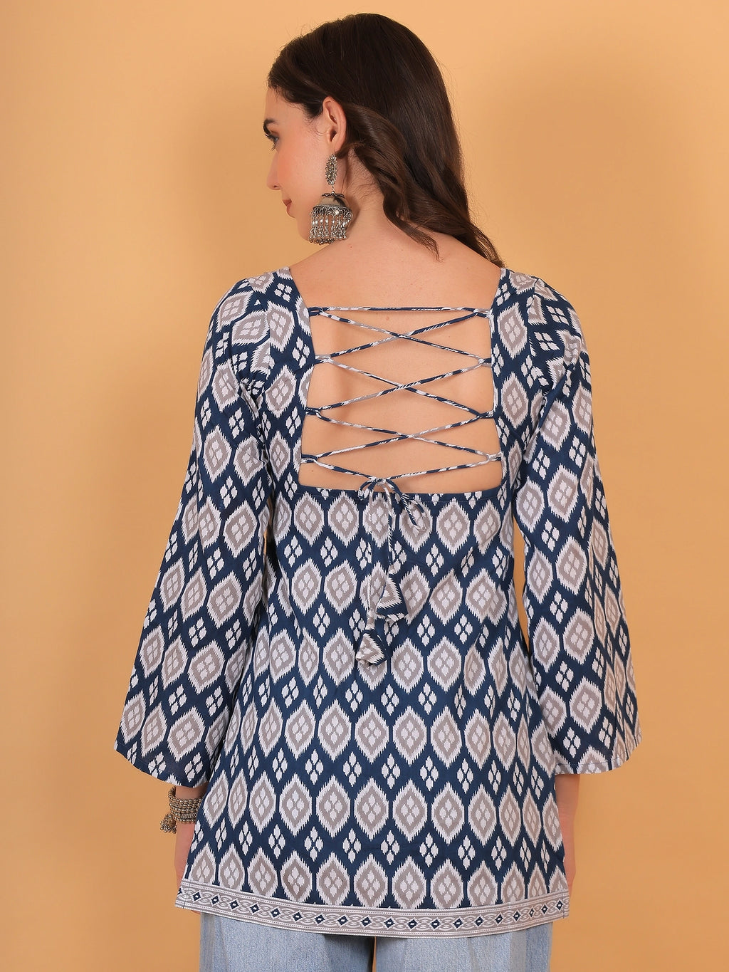 Rear close-up view of The Neelam kurti highlighting the fitted corset style backless design with adjustable dori tie-ups.