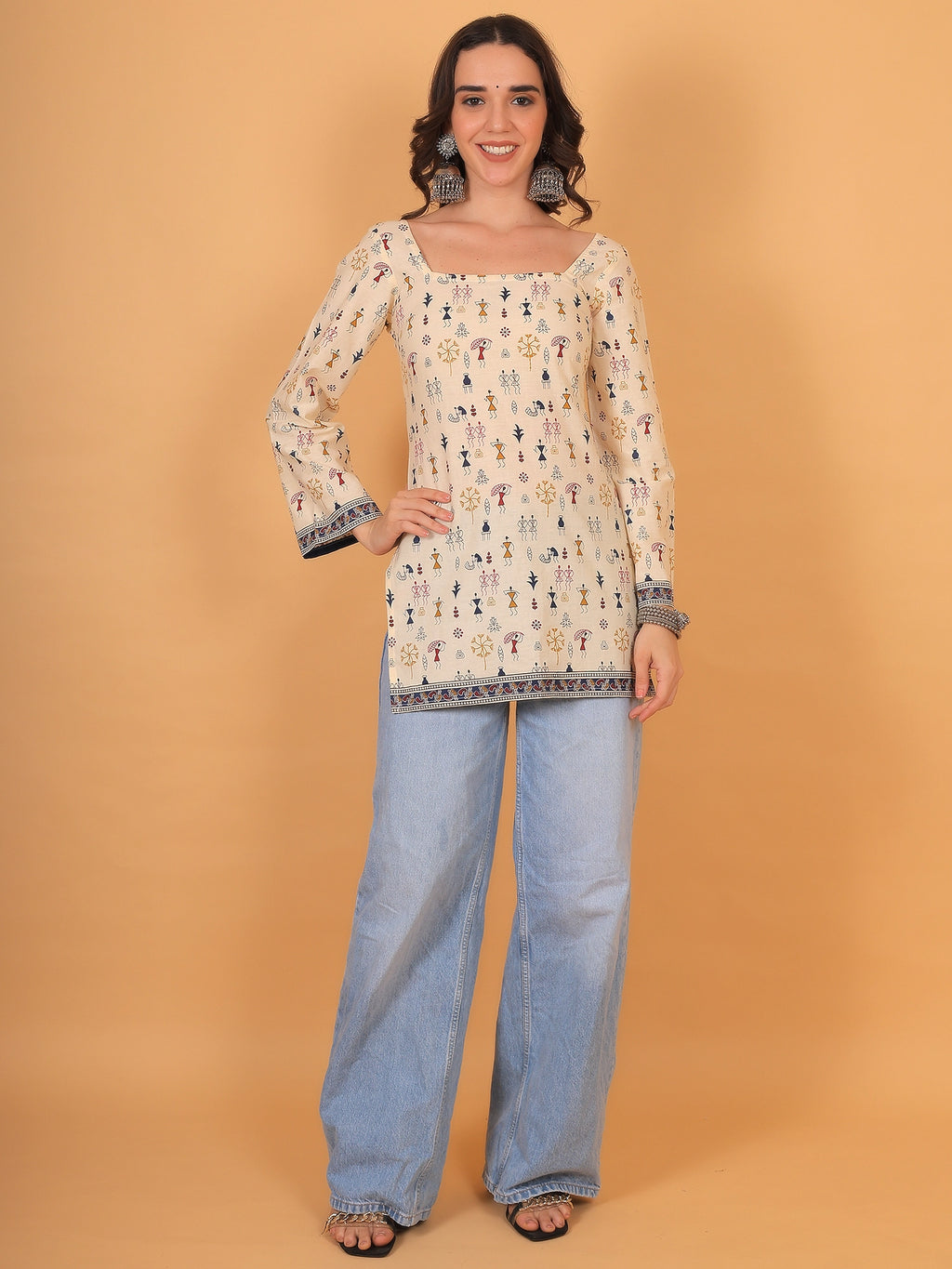 Trendy square neck beige printed short kurti styled with light-wash wide-leg jeans for a boho look.