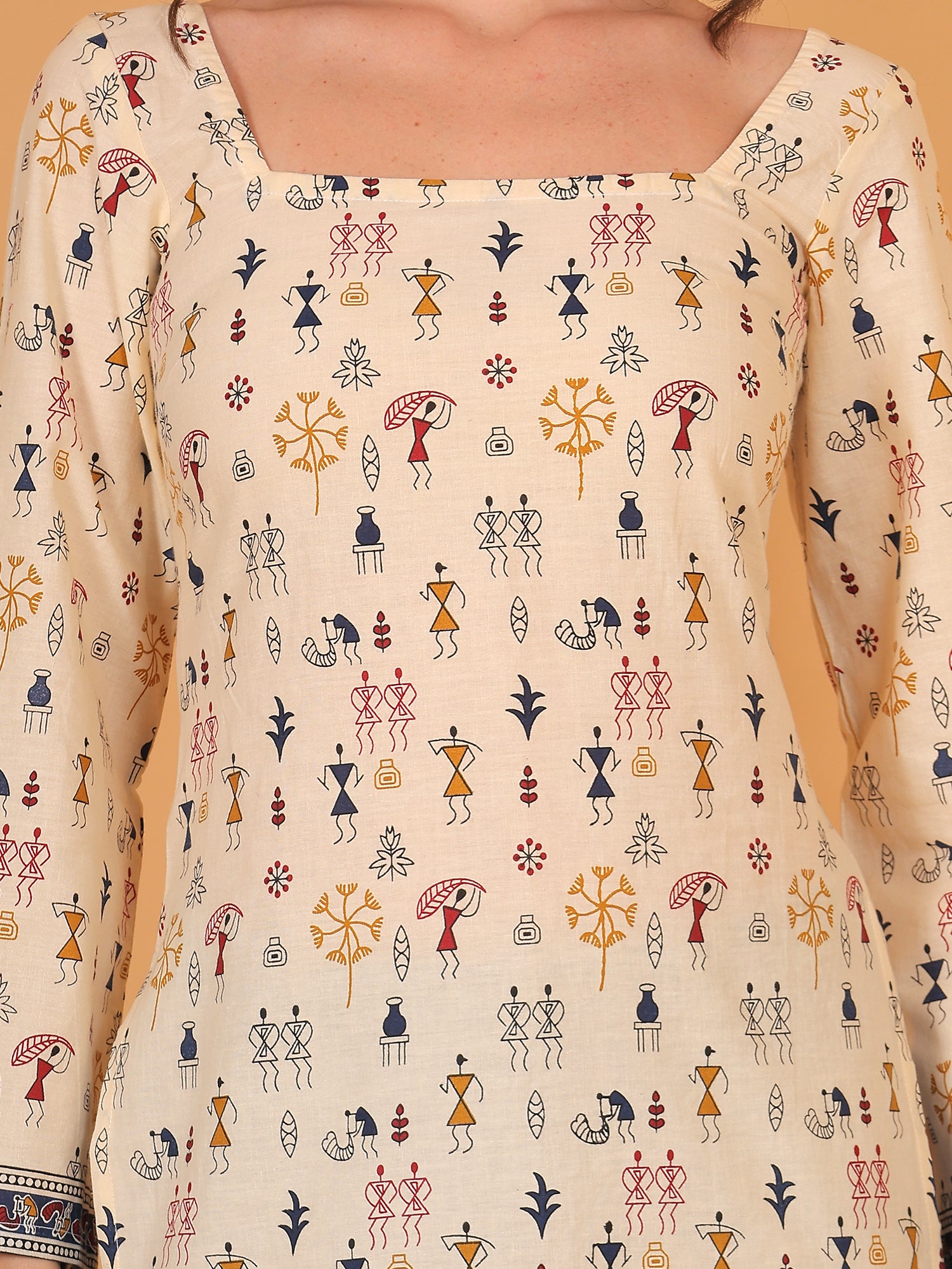 Close up of tribal stick figure print on off-white kurti