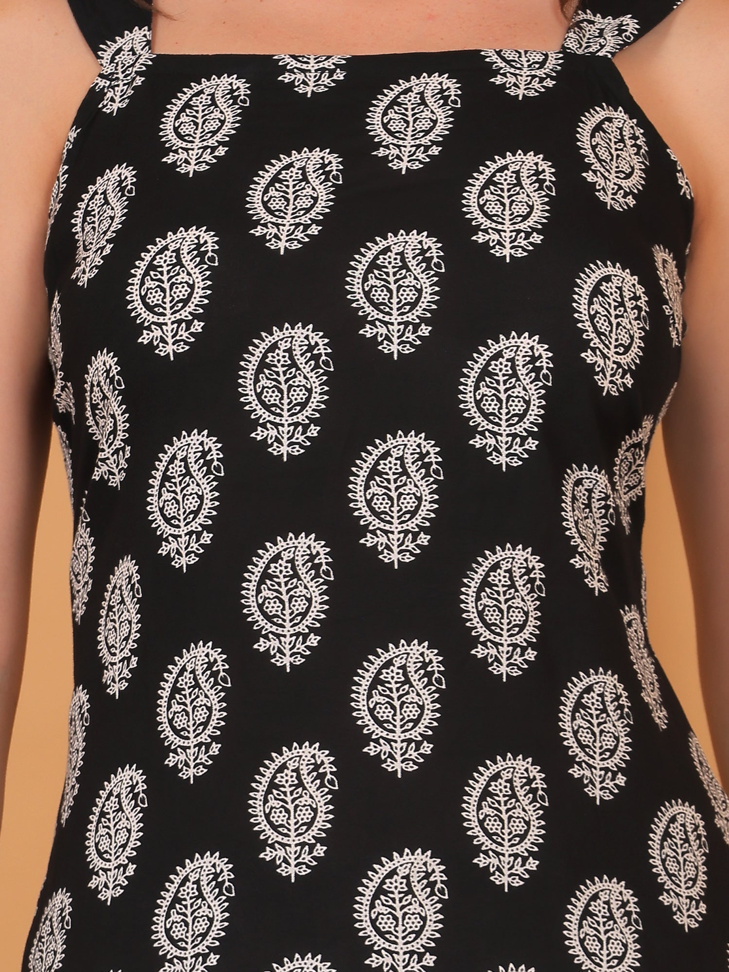 Indo western black sleeveless short kurti, perfect for college wear or a casual summer outfit.