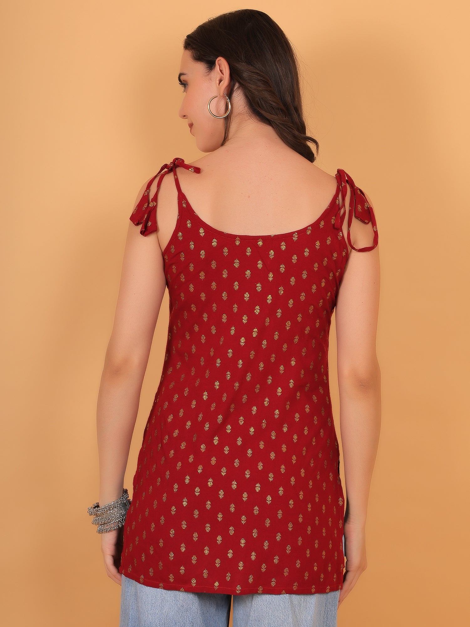 Side view of red short kurti showing adjustable dori strap details