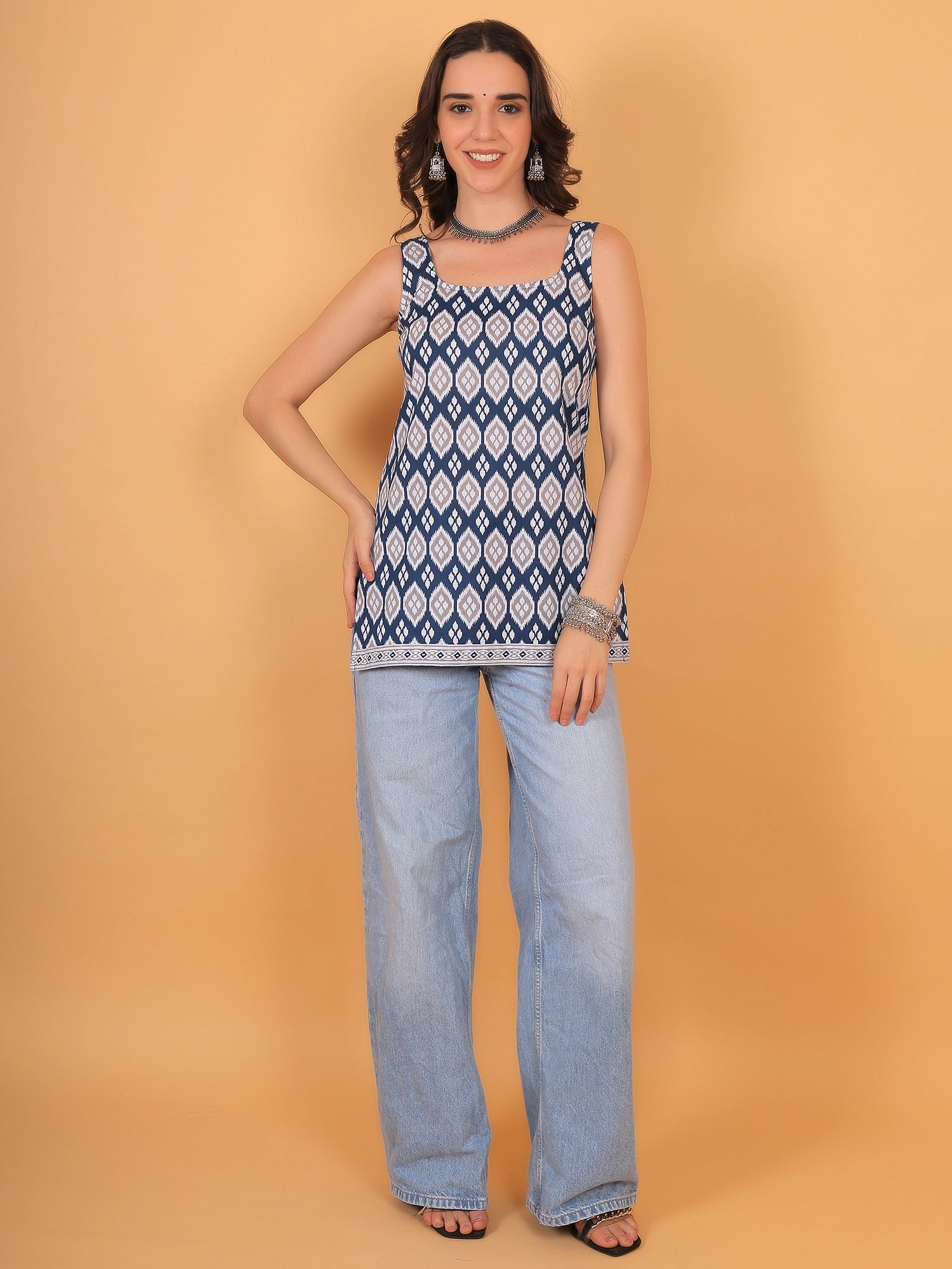 An A-printed sleeveless kurti for women paired with wide-leg jeans, a stylish ethnic casual cotton summer top, and a full outfit.