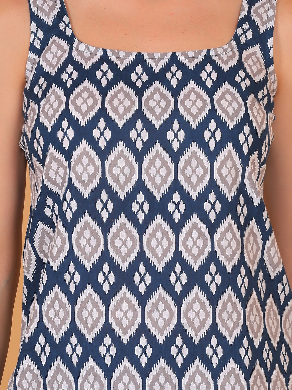 Women's ethnic-printed sleeveless cotton kurti top with a square neck, a casual summer Indo-Western tunic for women, front view.