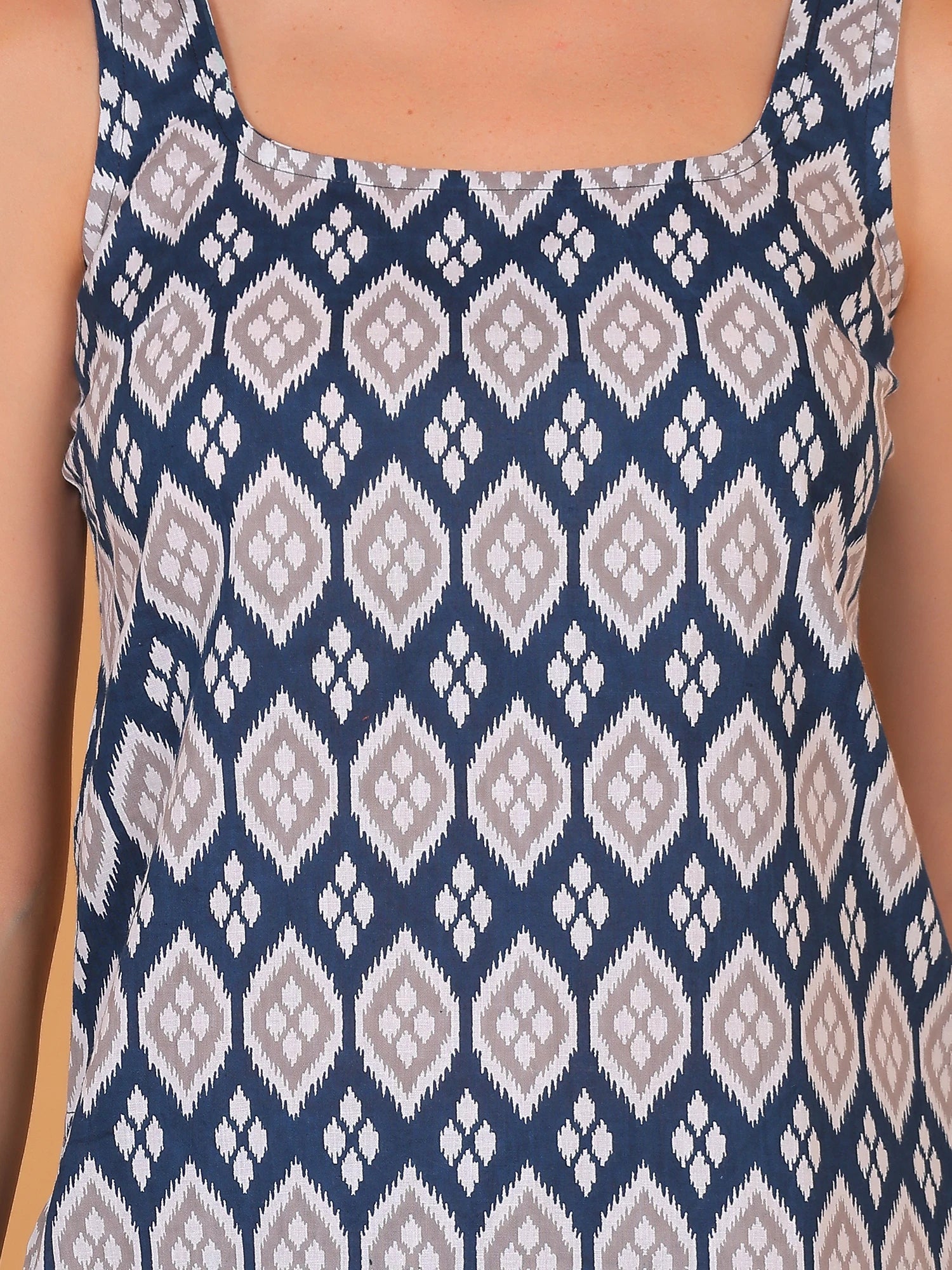 Women's ethnic-printed sleeveless cotton kurti top with a square neck, a casual summer Indo-Western tunic for women, front view.