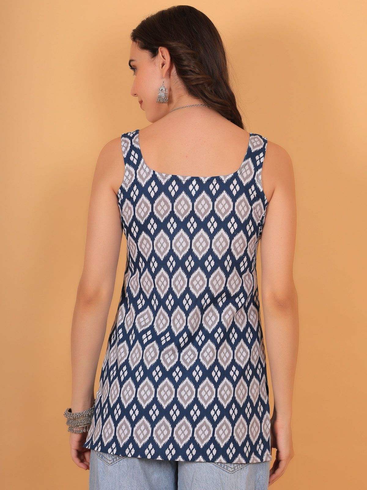 Back view of a printed sleeveless women's kurti with a square neckline, an ethnic cotton tunic for casual and office wear.