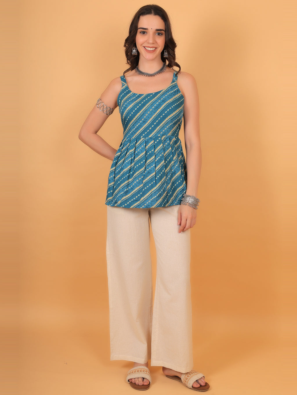 Cyan blue backless top styled with silver oxidized choker and bracelet.