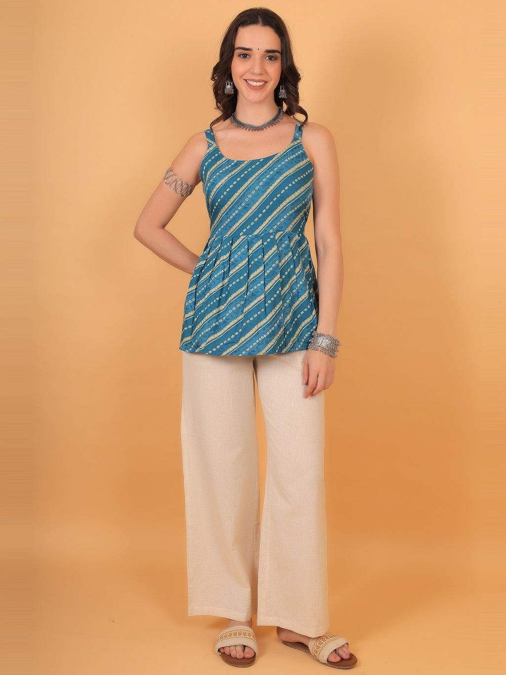 Casual outdoor styling of a breathable rayon indigo blue short kurti top, perfect for an everyday college outfit or light Diwali pre-festive wear.