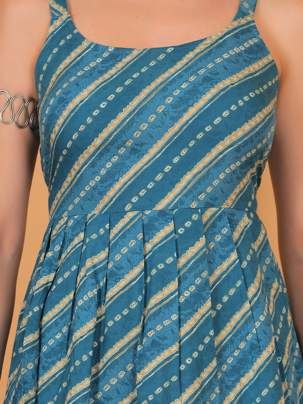Detail of diagonal stripe and geometric motif print on cyan blue fabric