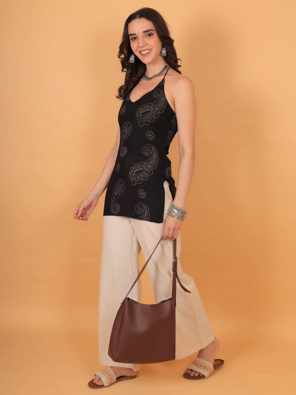 A stylish black and white printed rayon kurti for women, ideal for festival wear, college styling, or casual ethnic parties.