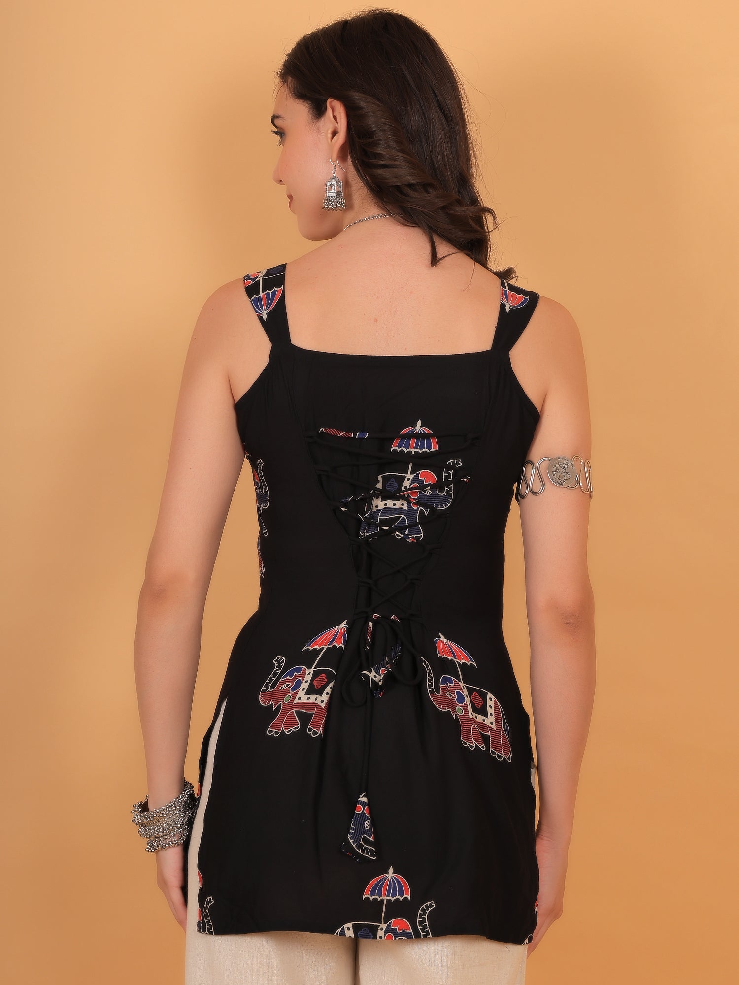 Close up of corset style criss-cross dori tie-up on black ethnic top