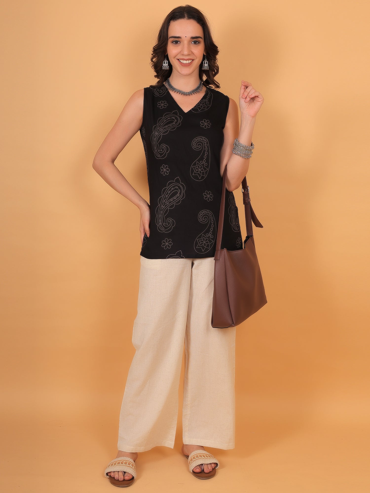 Model wearing black sleeveless short kurti with print - Zuacc dailywear collection