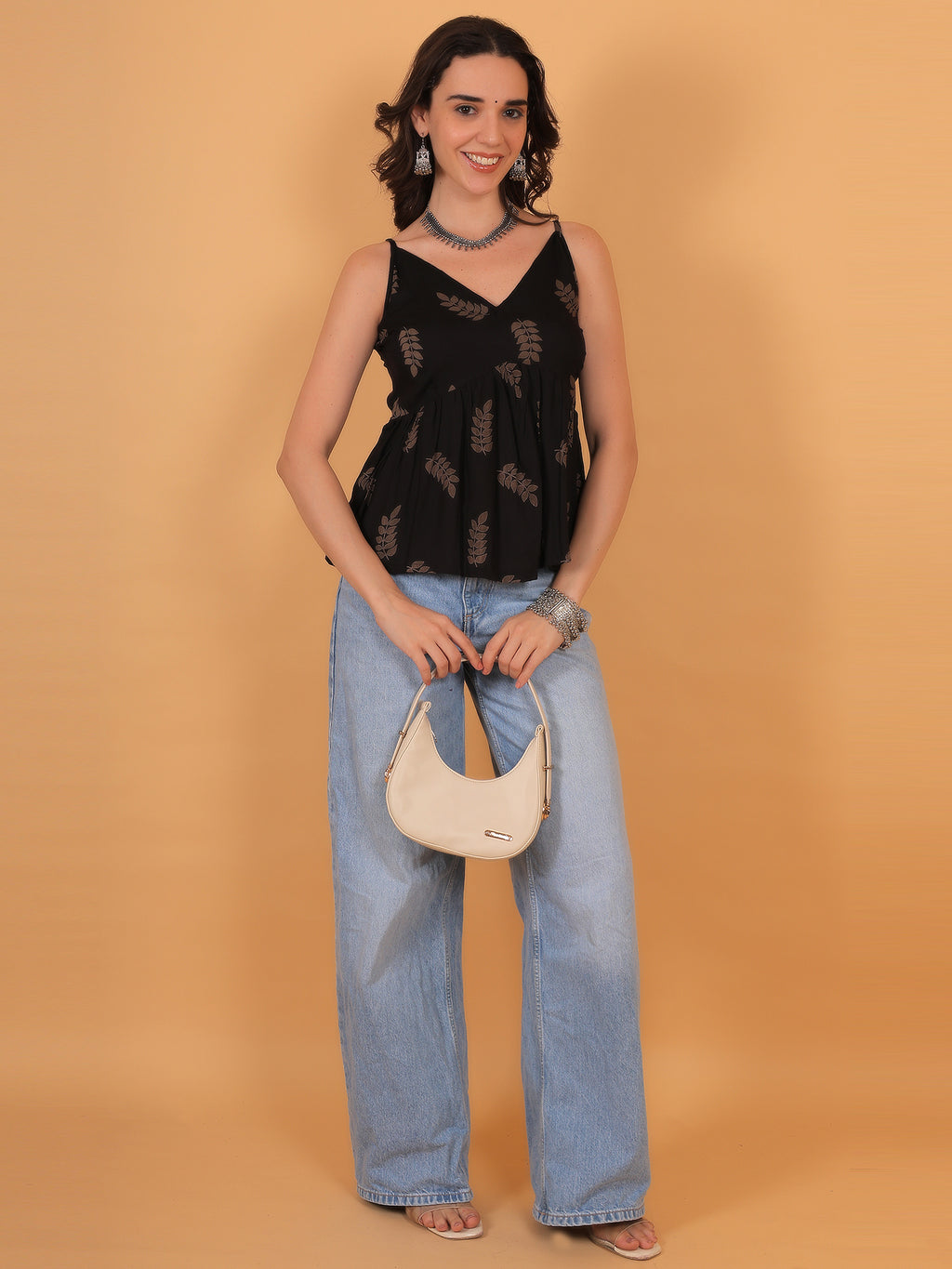 Stylish black short top for women paired with wide leg denim - Zuacc collection