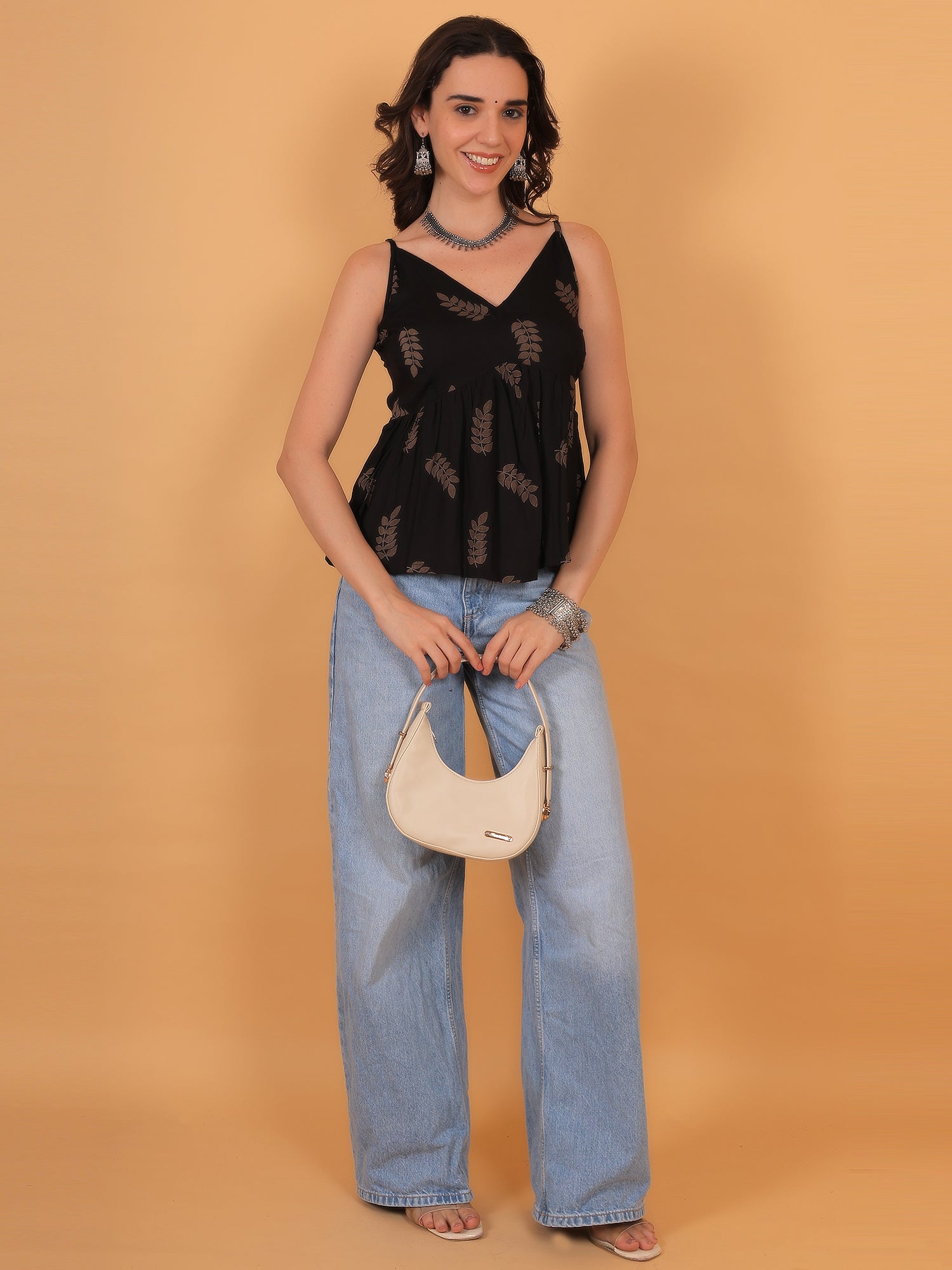 Stylish black short top for women paired with wide leg denim - Zuacc collection