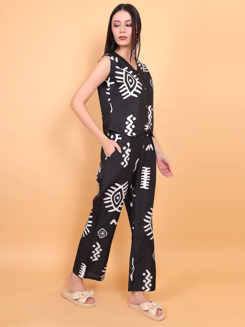 side view of the matching vest and pull-on trousers set, highlighting the clean silhouette and pattern continuation.