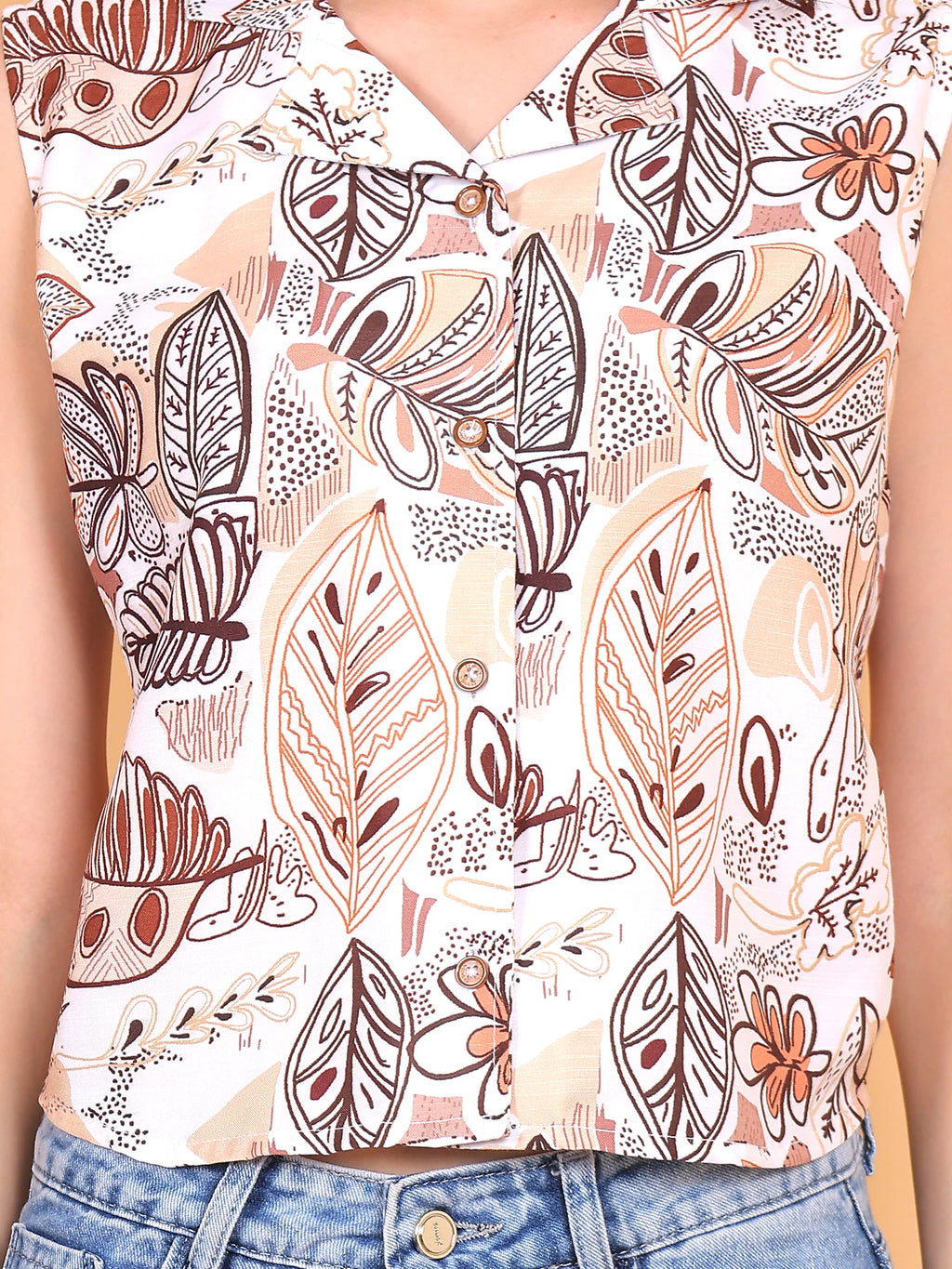 Close-up shot of the white Aurea button-up top, showcasing the detailed abstract floral print motifs on opaque polyrayon fabric.