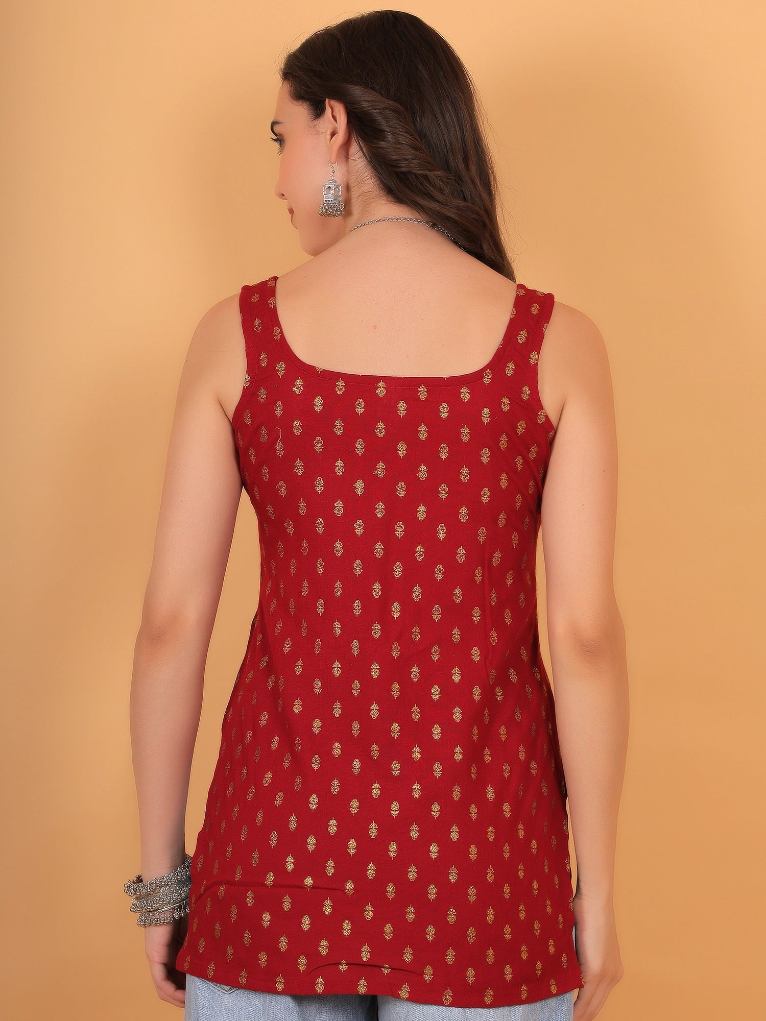 Model wearing a regular fit red rayon kurti, showcasing a modern straight-cut silhouette in Indian wear