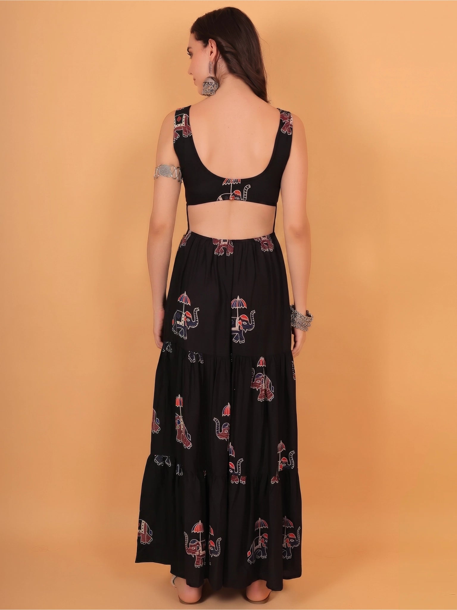 Detailed back view showing a bold backless gown design with a regular fit tie-up closure, offering unique fit inspo for Indian wear.