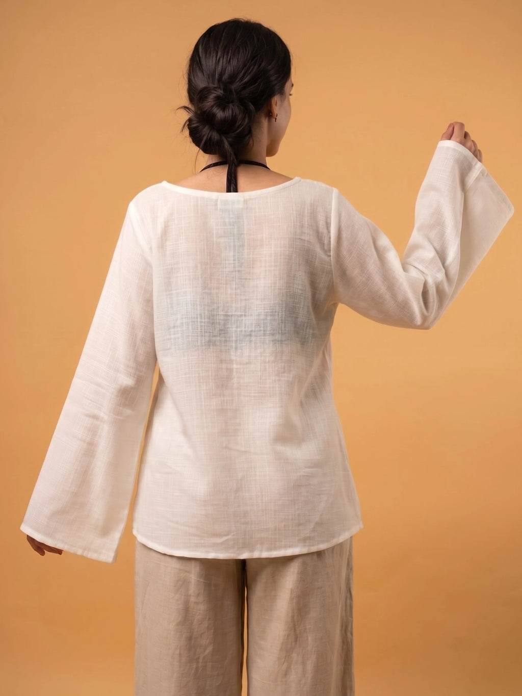 Back view of the oversized Zora sheer cover up showing the relaxed fit and long sleeve flowy design.