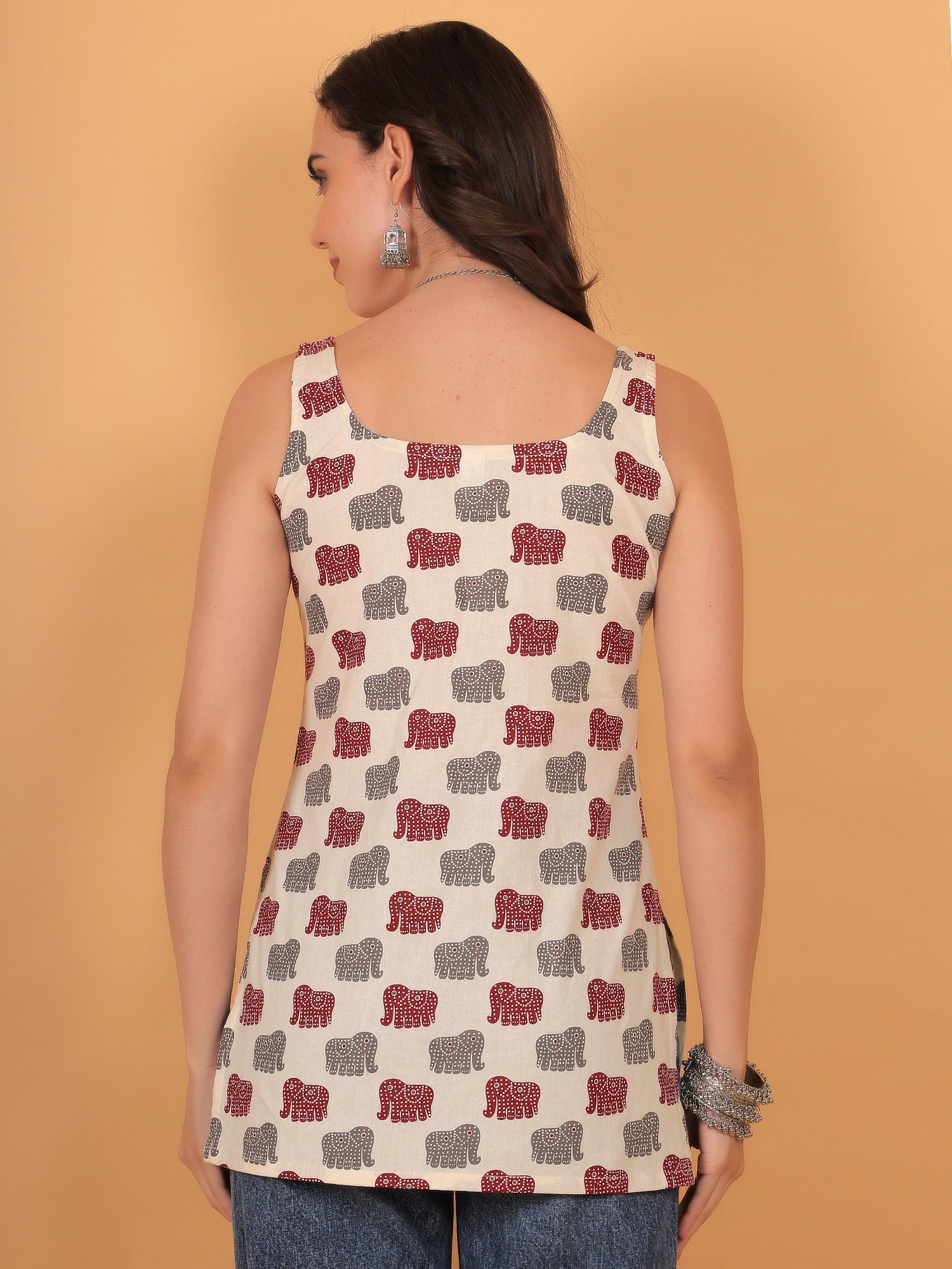 Back view styling of the sleeveless elephant print kurti, showcasing a clean square back design and regular fit in a lightweight breathable fabric.