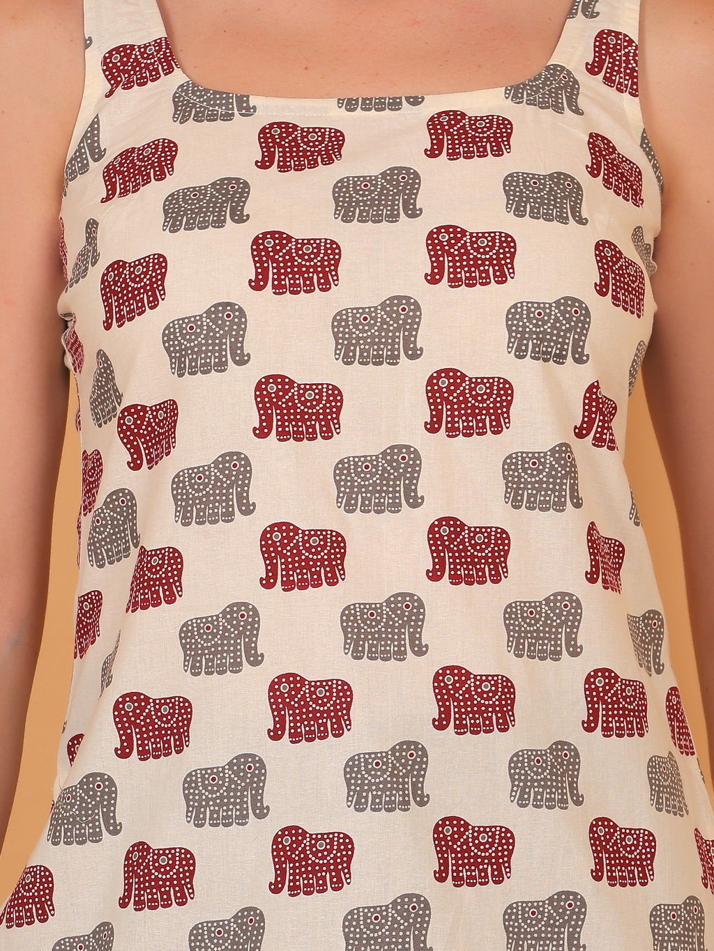 Breathable cream cotton kurti with playful animal motif design.