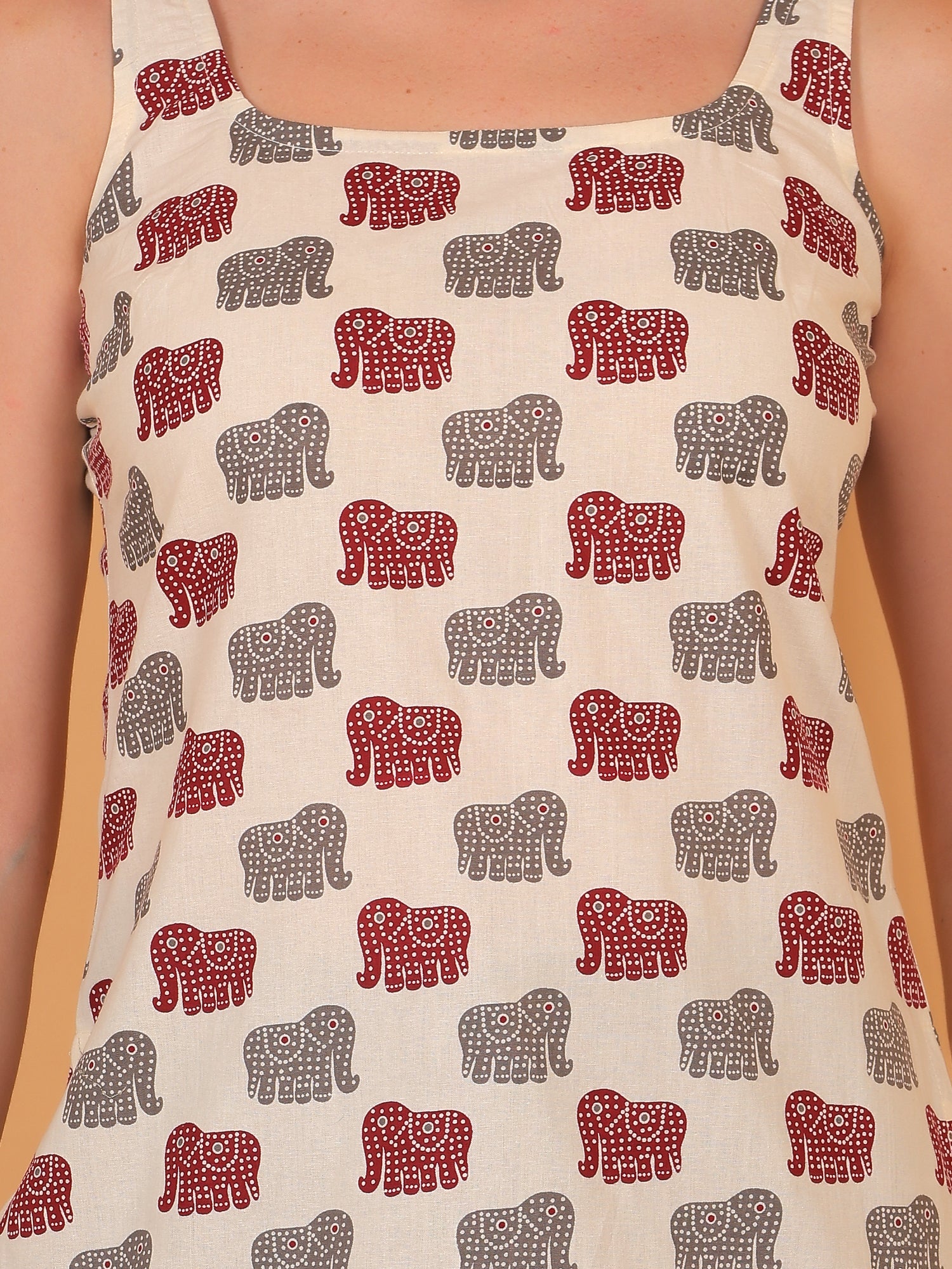 Breathable cream cotton kurti with playful animal motif design.