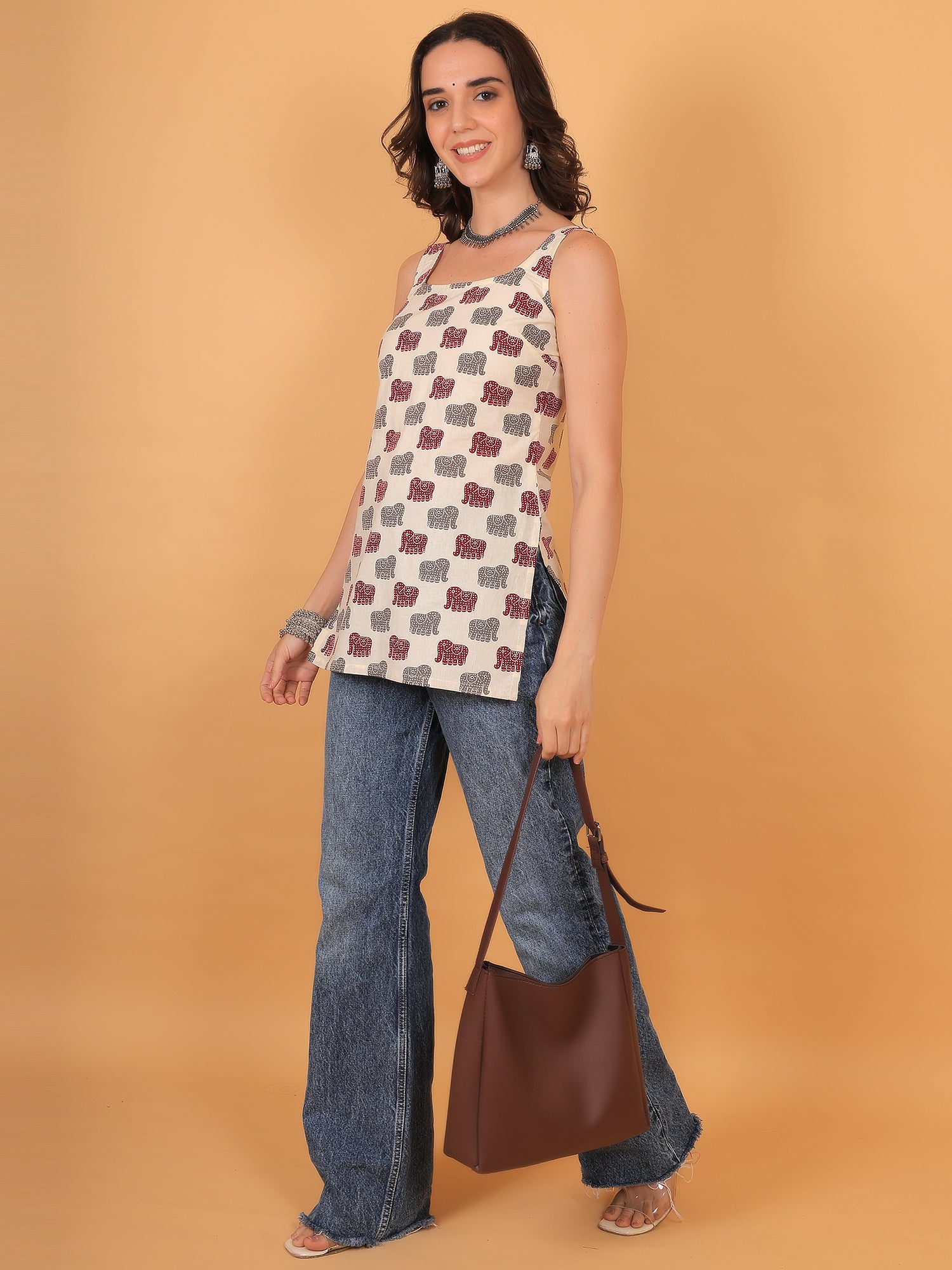 Close up of traditional block style elephant print on off-white cotton fabric