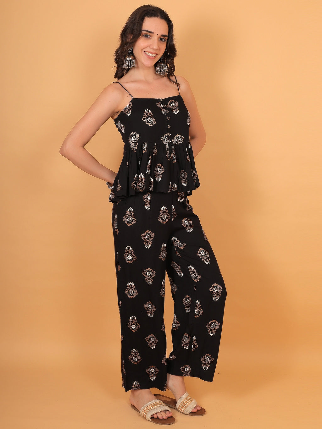 Flattering movement of a women black indo western co ord set with flowy wide-leg pants, offering trendy fit inspo for party wear.