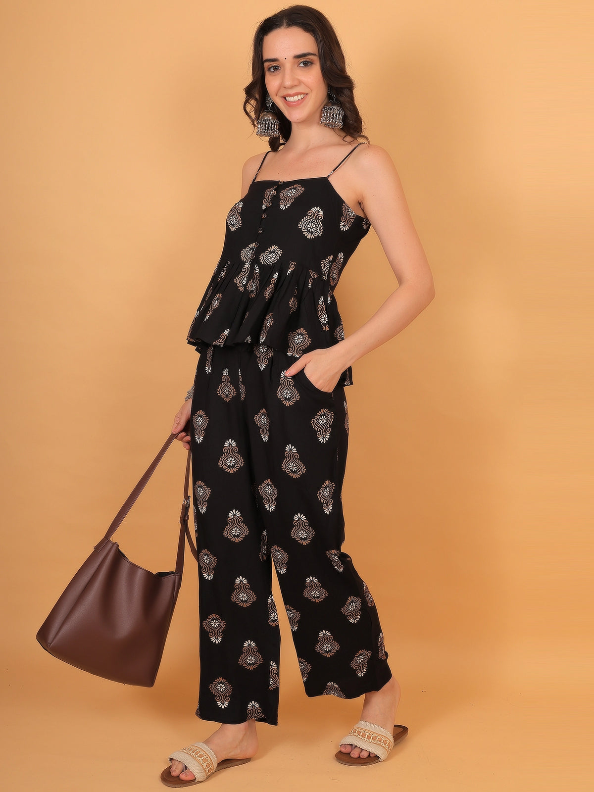 Side profile styling of a women black indo western co ord set in a breathable fabric, ideal for a chic casual outing or date night.