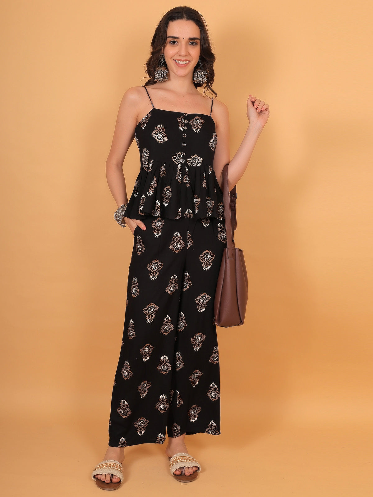 Full-length styling inspiration of a women black matching top pants ethnic set, a perfect outfit choice for festive wear or a college fest.
