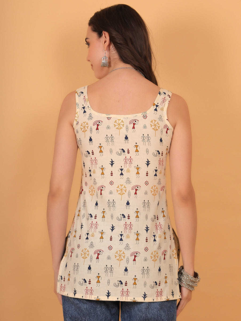 Back view styling of the sleeveless warli print kurti, showcasing a regular fit silhouette and a clean square back design.
