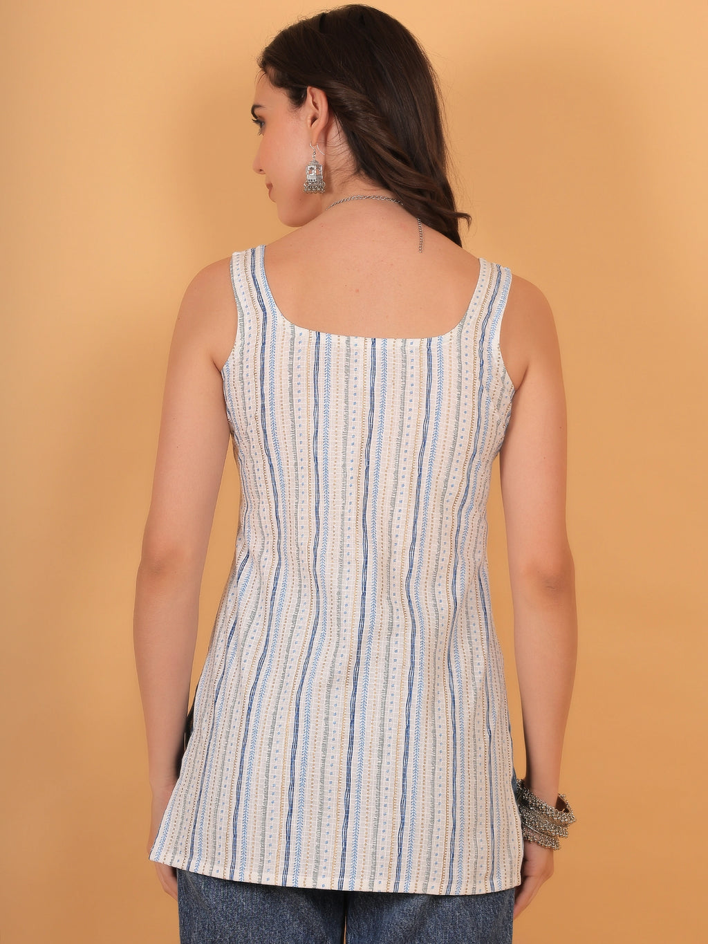 Back view styling of the white sleeveless short kurti, showcasing a clean regular back design and a comfortable regular fit.