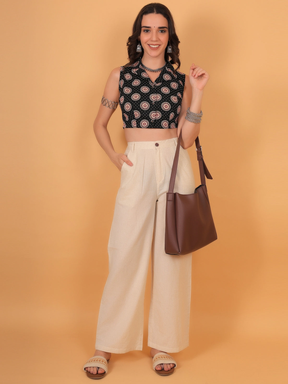 Trendy indo western styling of an ethnic shirt crop top worn open as a vest or paired with a flared skirt, creating a perfect outfit for festive wear.