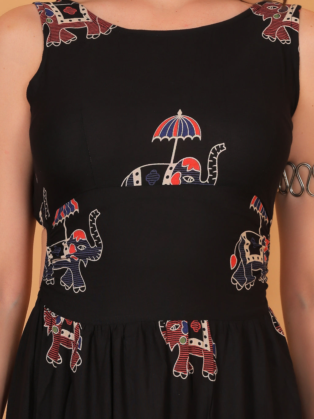 fitted sleeveless bodice and flared maxi skirt