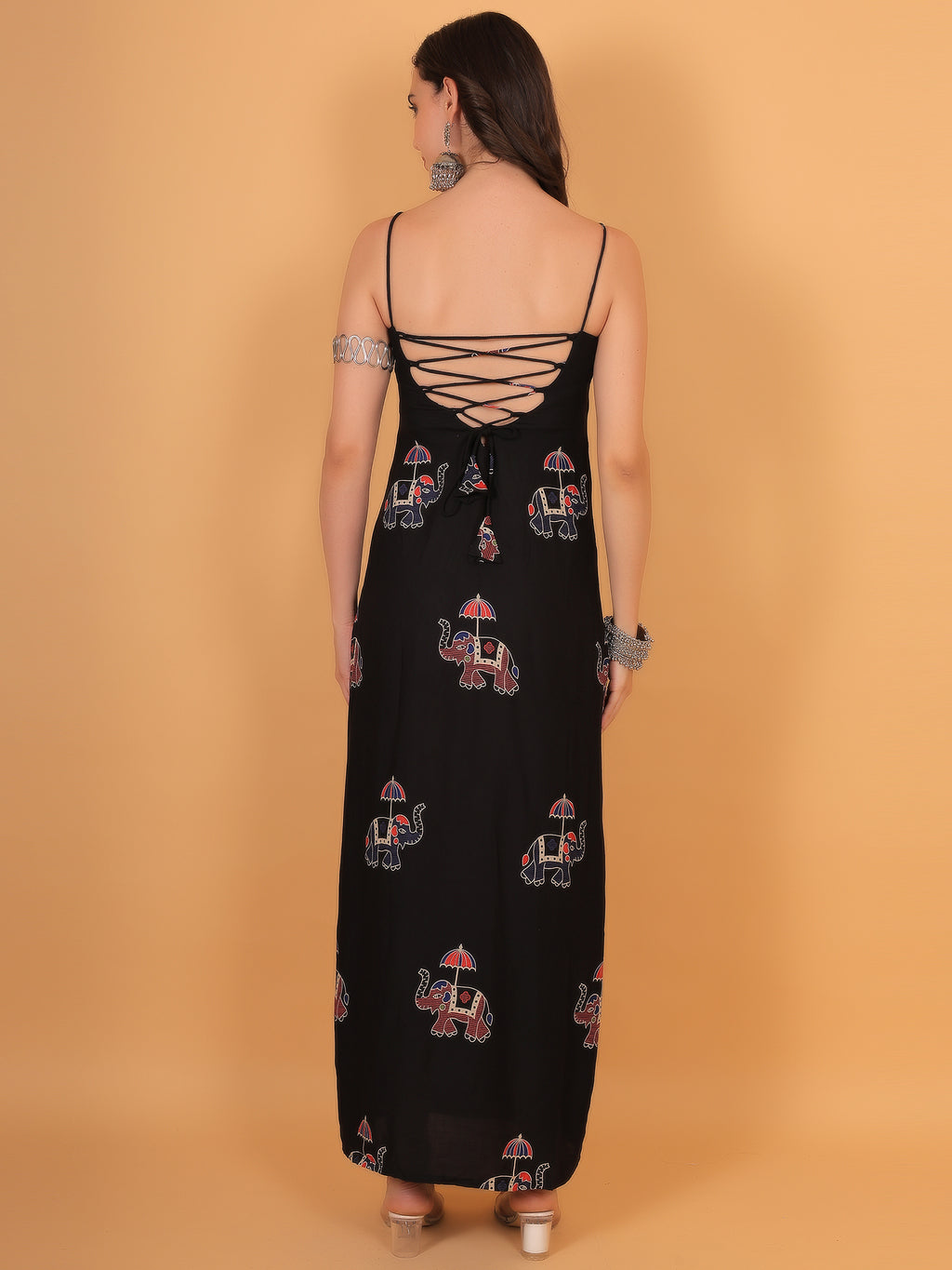 Close up of corset style lace-up back design on black vacation dress.