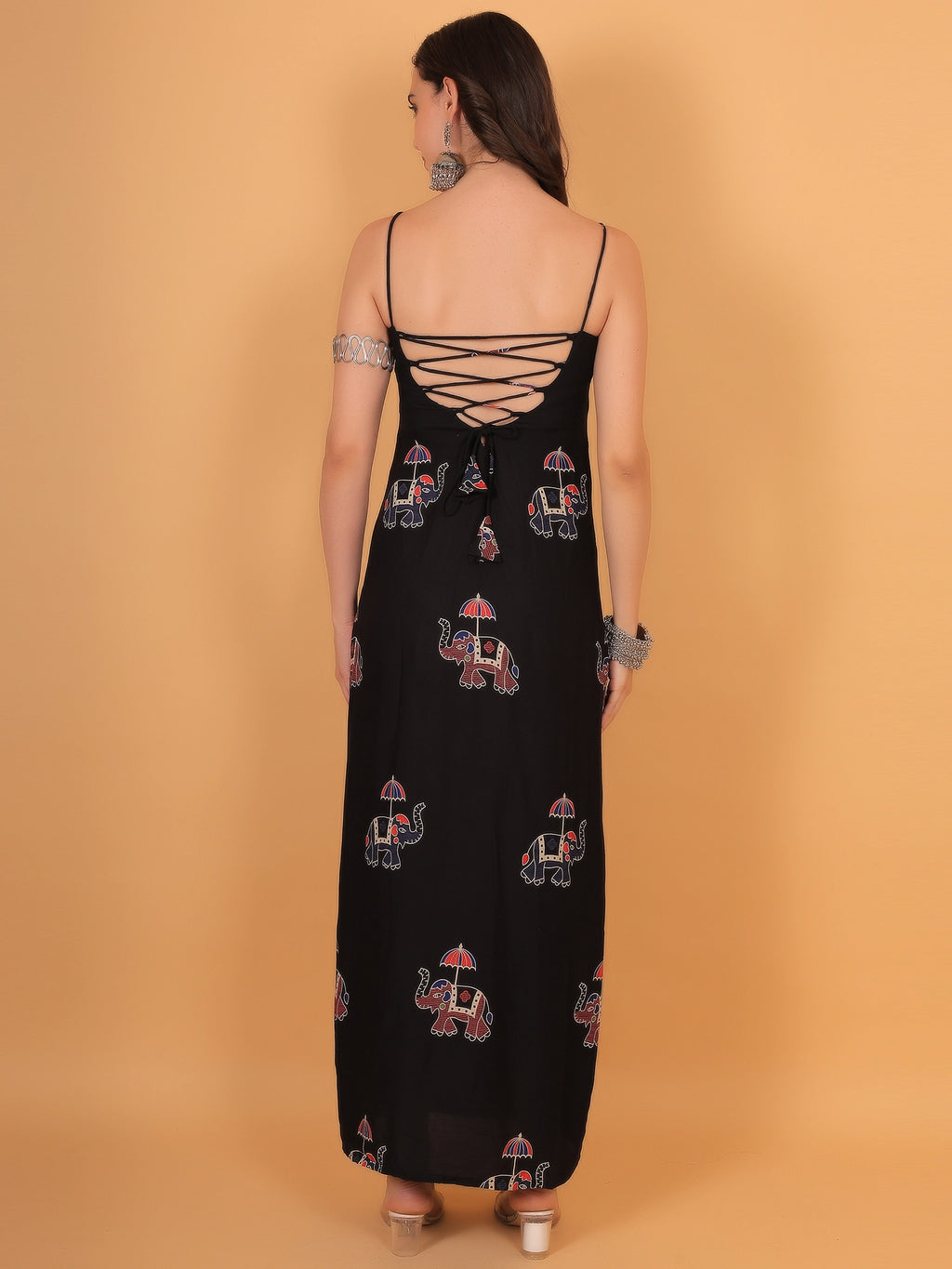 Detailed close-up of a backless black dress featuring an intricate criss cross corset back design in a lightweight, breathable fabric.