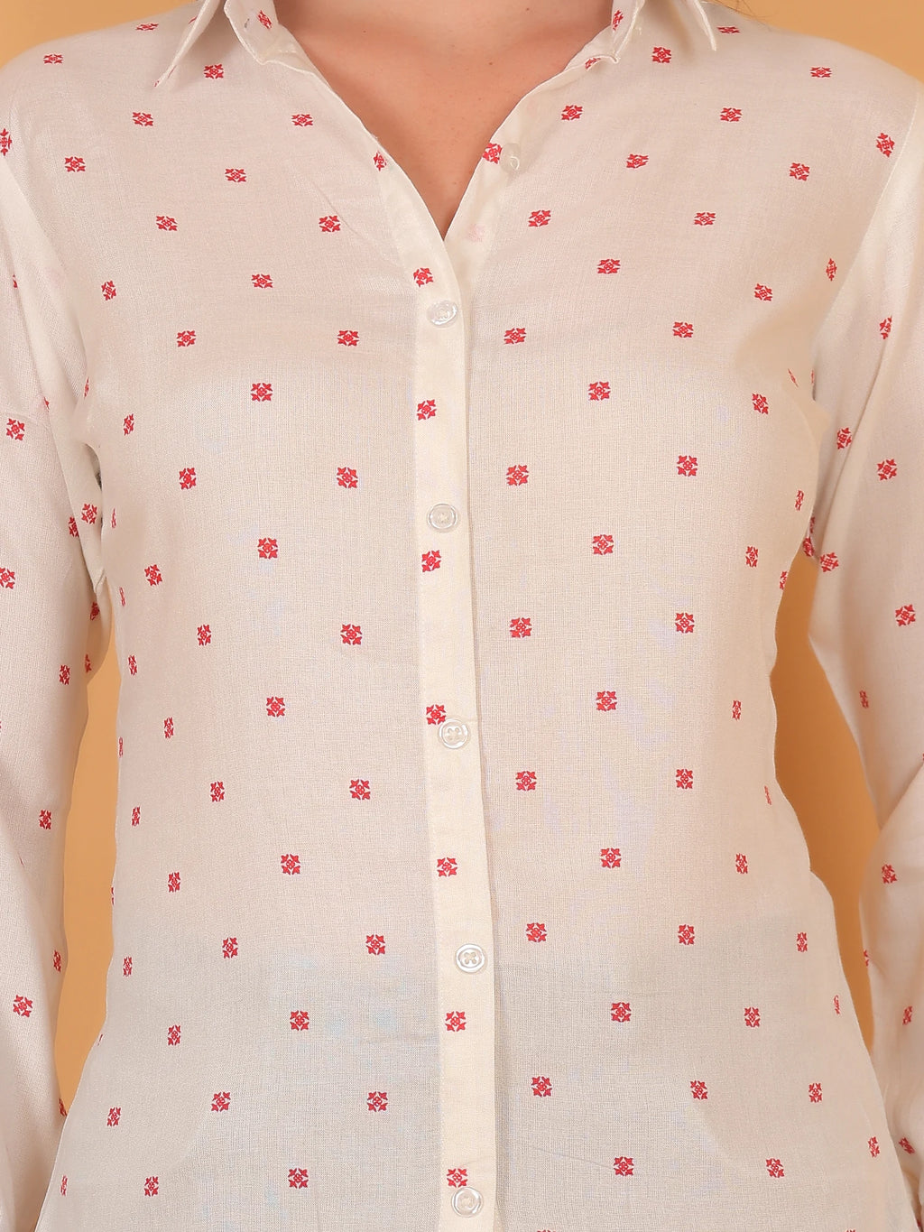Close-up detail of a women white button-down shirt with a geometric print pattern, highlighting the breathable cotton rayon fabric texture.