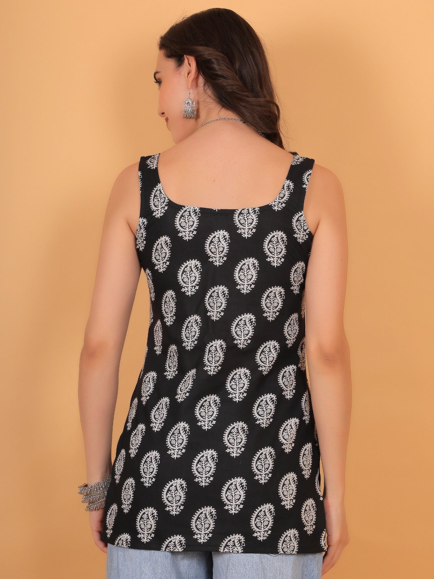 Back view of women's black sleeveless Kaashni-printed straight cotton kurti with square neckline
