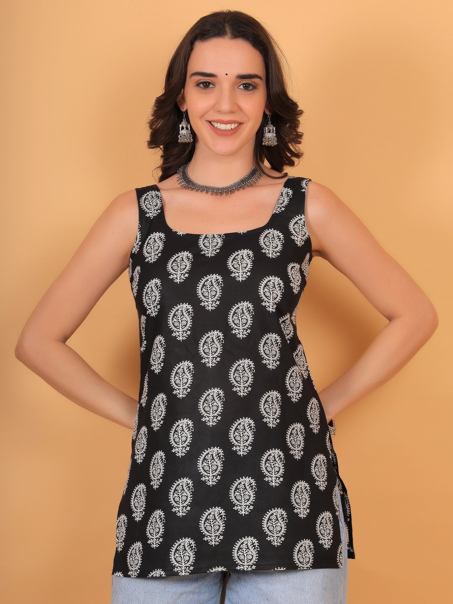 Women's black sleeveless cotton kurti top with white floral block print, square neck, and side slits—casual ethnic summer wear for women.