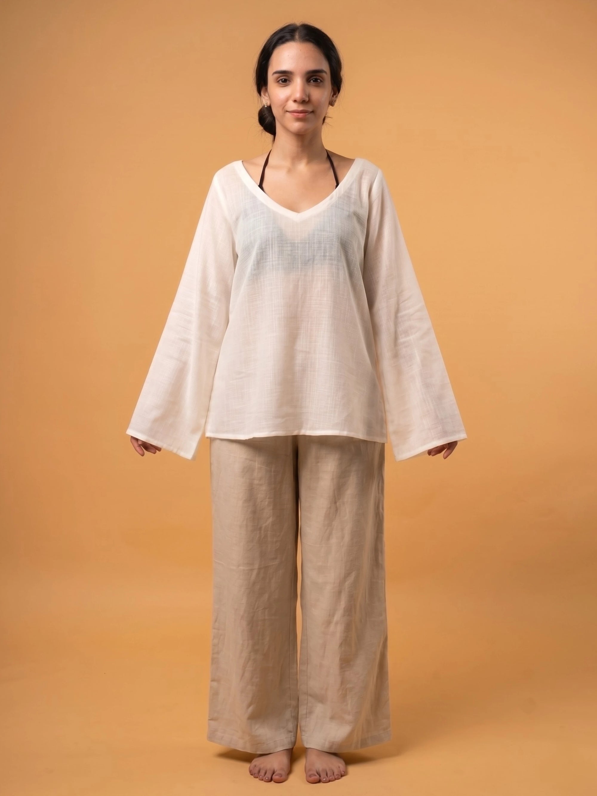 Translucent white rayon slub coverup styled as a multipurpose top over a traditional Indian tunic dress.